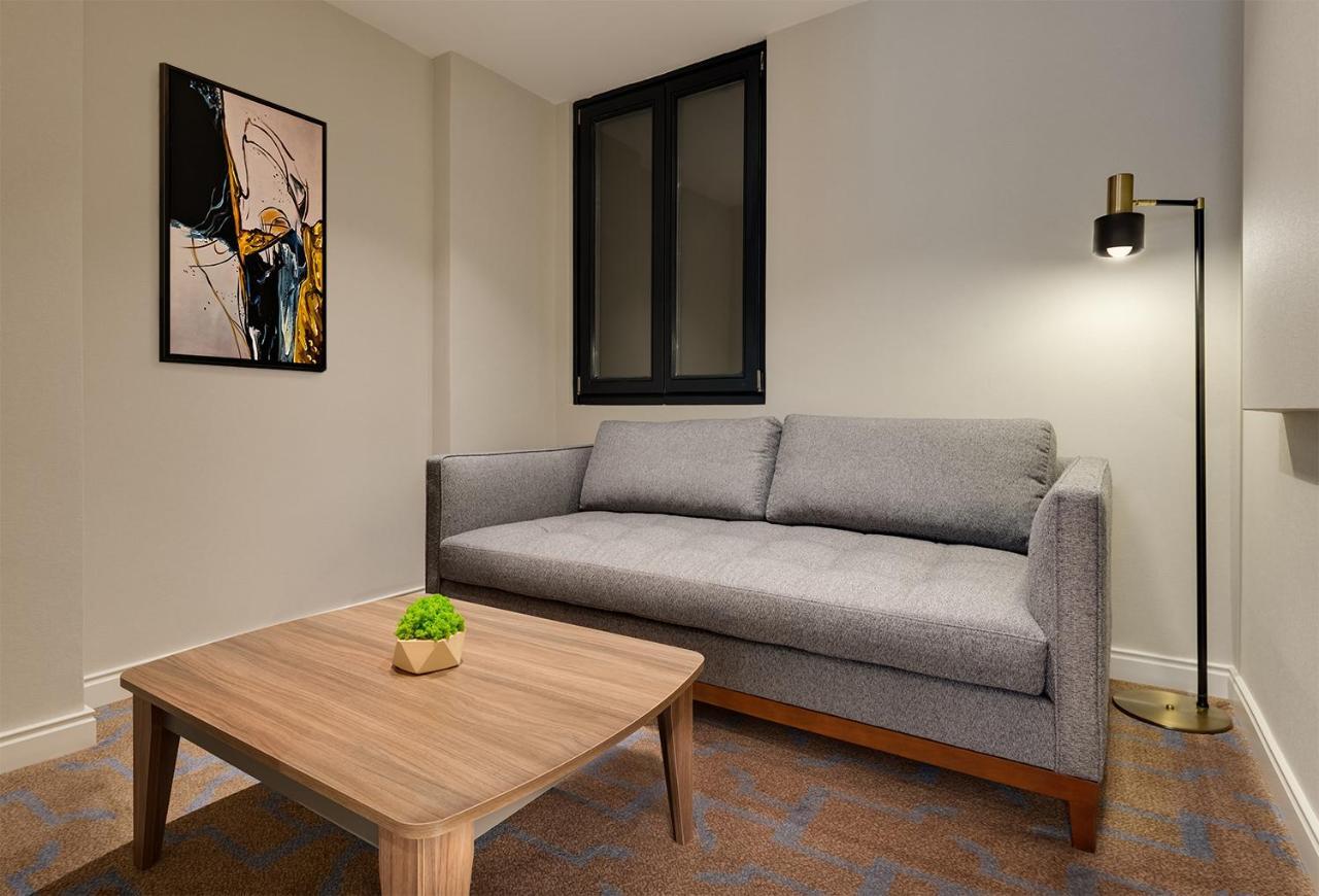 Gleam Collection Hotel Istanbul Exterior photo A living room with a sofa